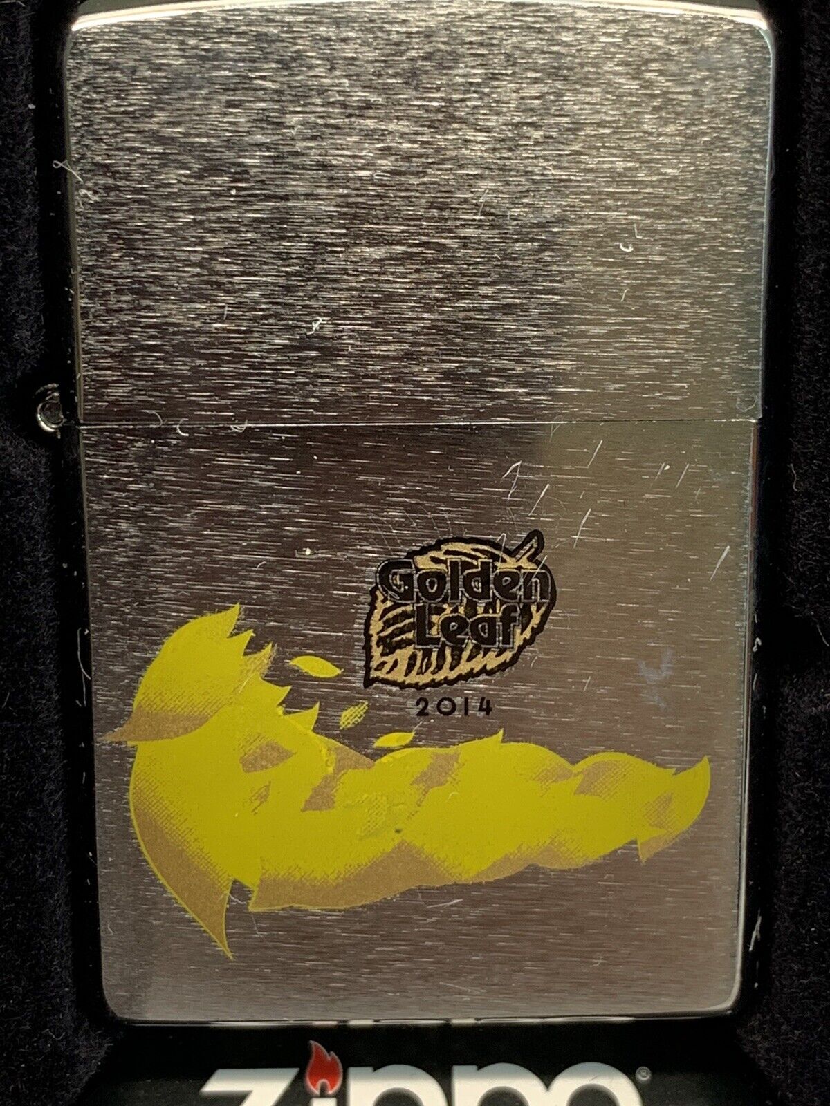 Golden Leaf Zippo Lighter Sealed In Box 2013. Some light scratches on face.